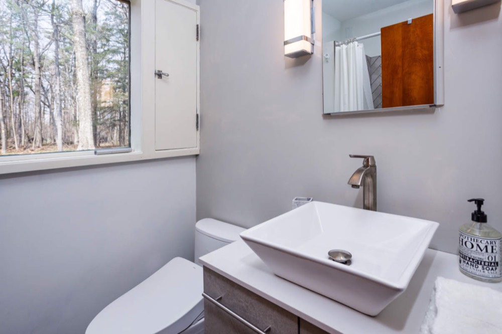 Guest bath with a soaking tub and Toto toilet